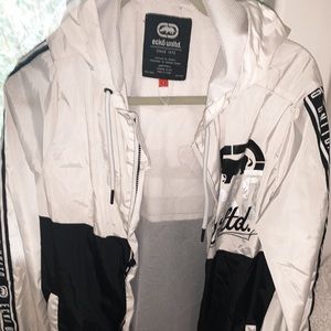 Black & white , wind breaker .